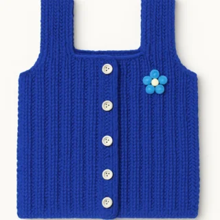 Handmade royal blue knitted baby wool vest with white buttons and blue flower patch – cozy sleeveless winter wear for newborns and toddlers.